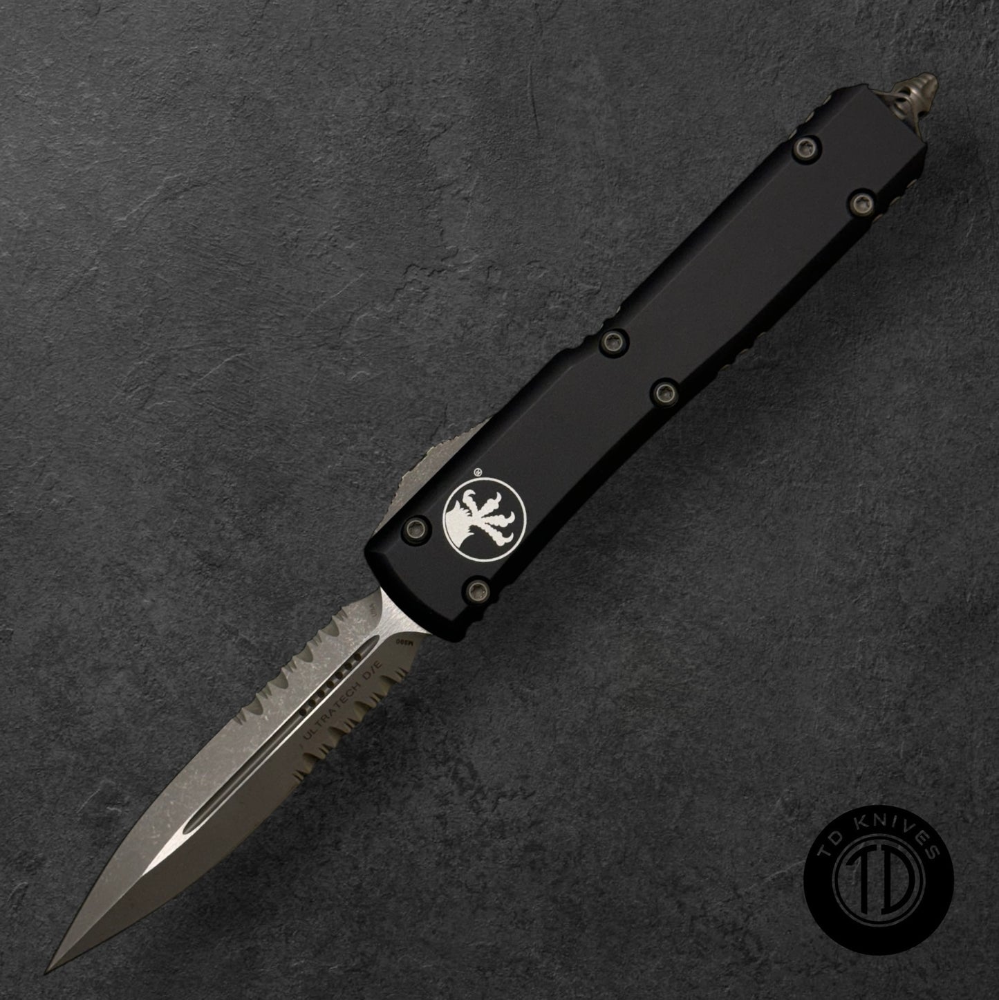 MICROTECH - Ultratech Partial Serrated Double Edge in Black with Apocalyptic Finished Blade. Model # 122-11 AP