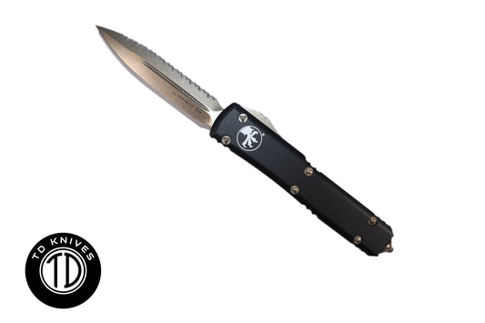 MICROTECH - Ultratech Fully Serrated Double Edge in Black with Bronze Blade and Hardware. Model # 122-15