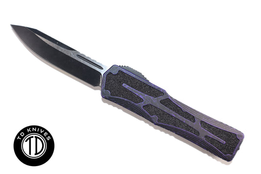 HERETIC - Colossus in Breakthrough Purple W/ Single Edge Two Tone Battle Black Magnacut Blade Finish. Model # H039-14A-BRKPU